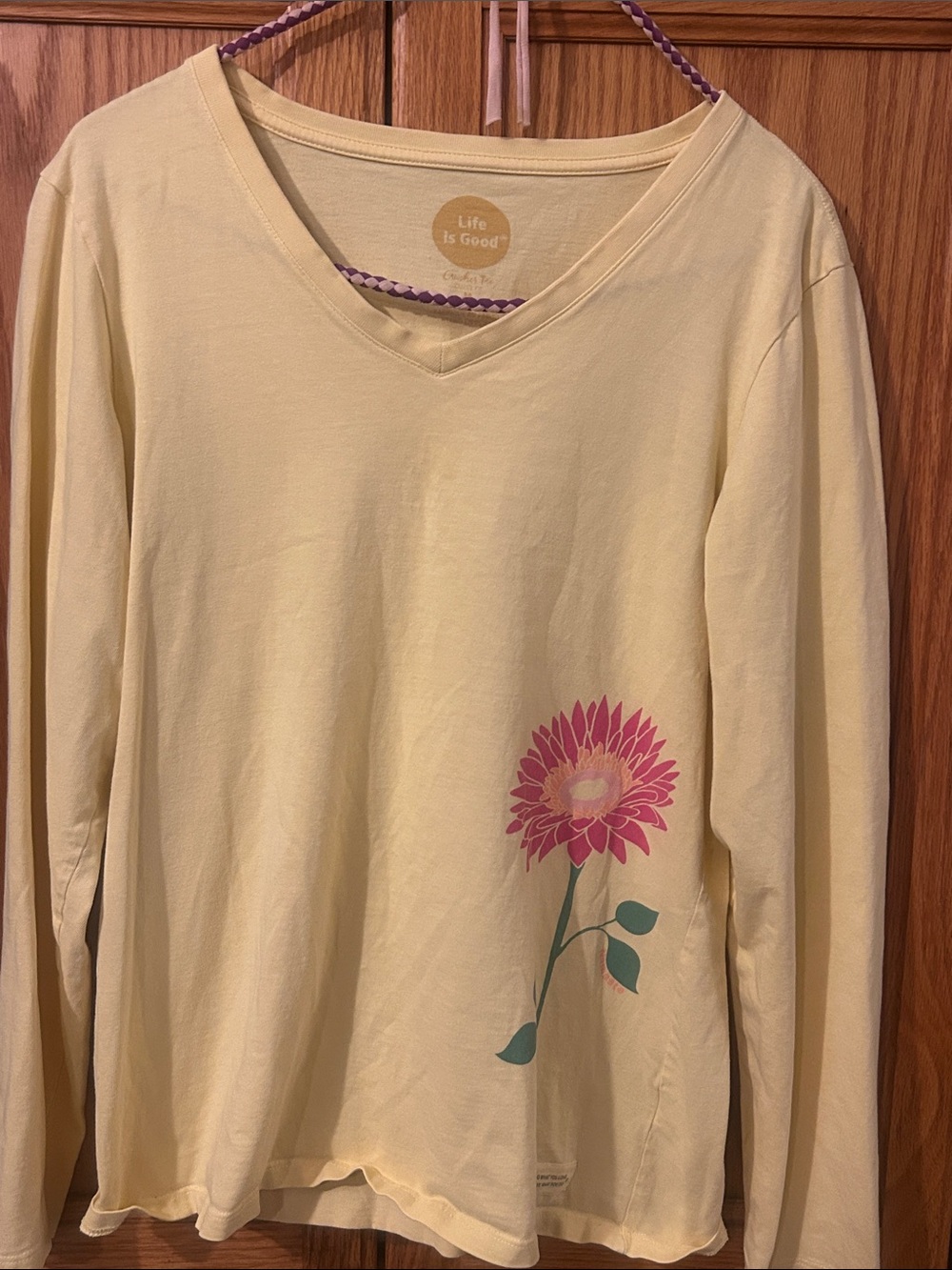 Life Is Good Pale Yellow V‑Neck Long Sleeve Top with Pink Flower Graphic